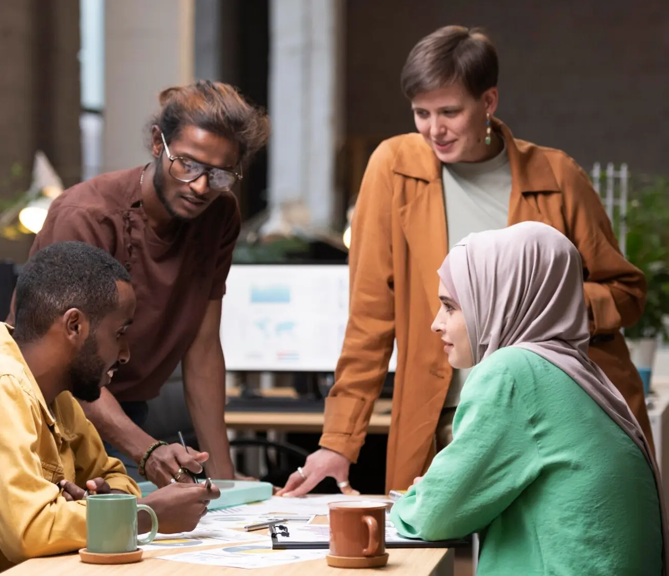 Flexible team of professionals working together in an office, representing agile workforce solutions with temporary staffing.