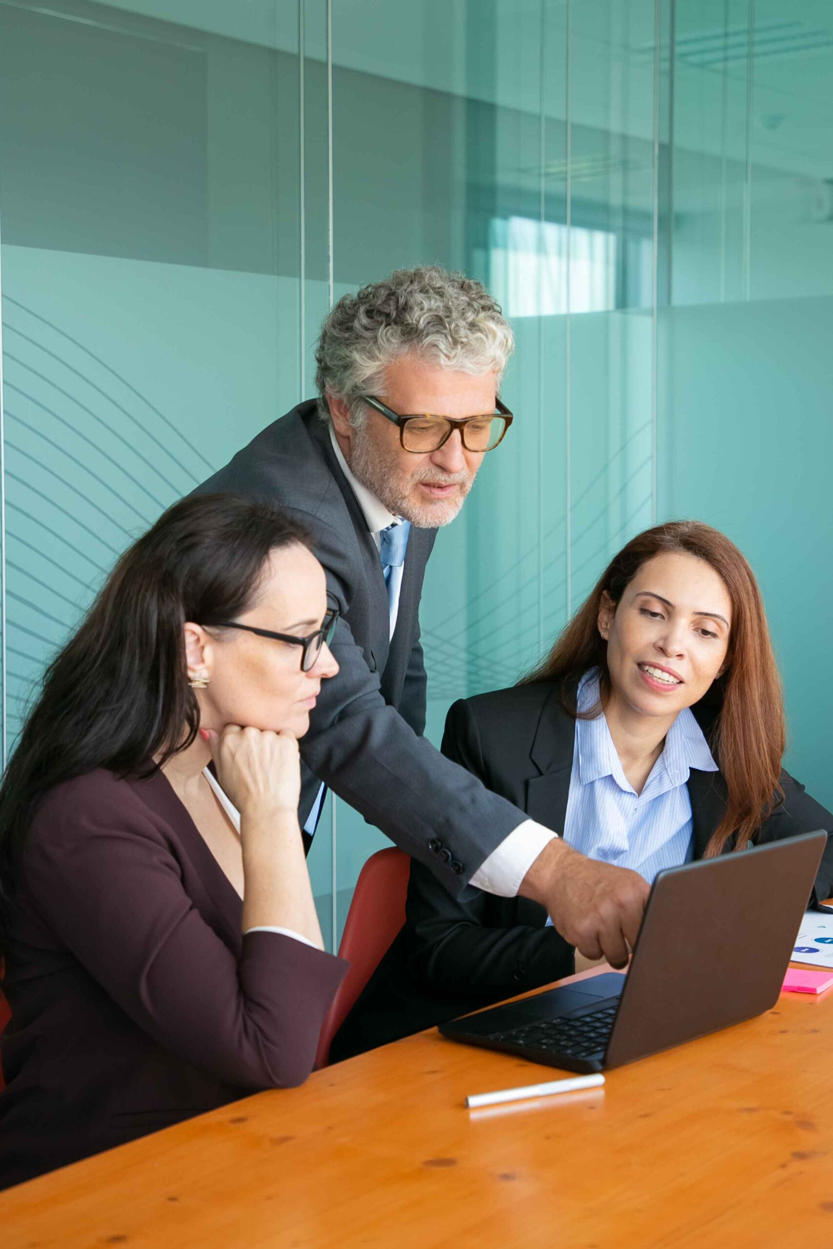 Diverse group of C-suite executives in a boardroom, showcasing Donsuk Consulting’s expertise in building leadership teams that drive organizational growth.